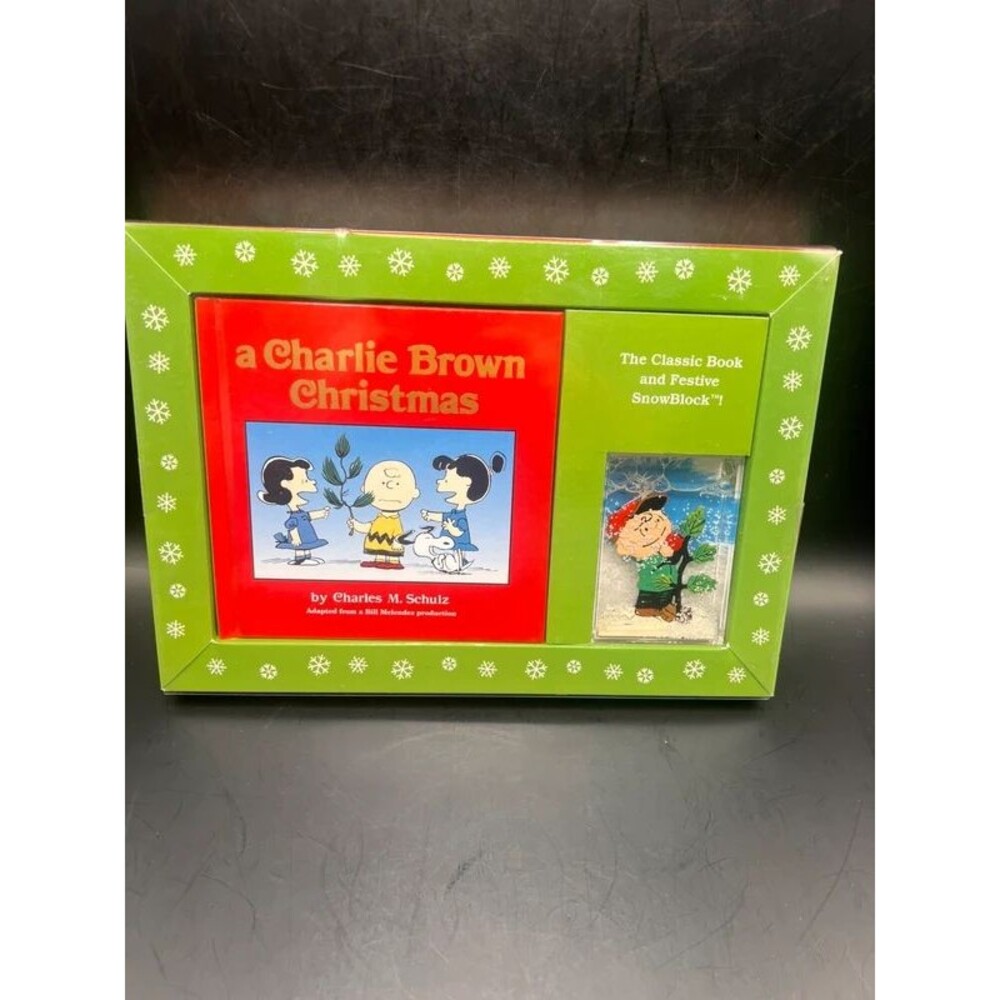 A Charlie Brown Christmas book and festive snowblock